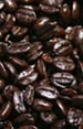 Shiny dark roasted coffee beans closeup